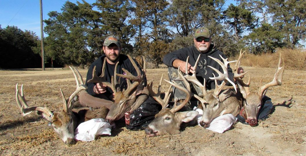 Hunters with Deer Kills